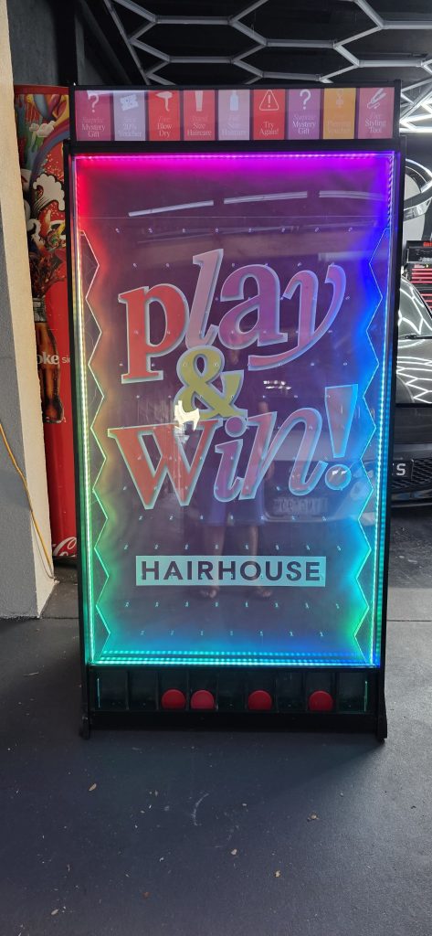 Custom branded arcade machine at a Melbourne hair brand launch event